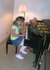 ele_caroline_piano_700.jpg (142715 bytes)